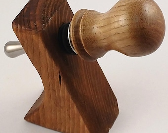Handmade wooden bottle stopper with a tear drop metal attachment