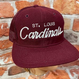 May include: A set of three ceramic mugs with a speckled, matte finish. The mugs are in shades of cream, light gray, and dark gray. Each mug has a simple, minimalist design, perfect for coffee or tea.