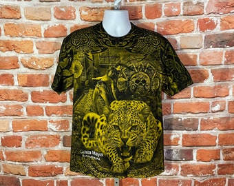 May include: Black t-shirt with a yellow and black print of a jaguar, Mayan-inspired artwork, and the text "Costa Maya K'AANAHAL"