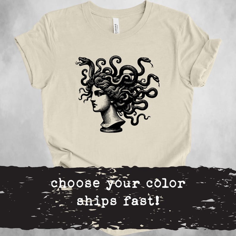 May include: A beige t-shirt featuring a black and white illustration of Medusa, a Greek mythological figure with snakes for hair. The text "choose your colour ships fast!" is printed below the illustration.