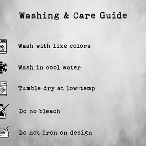 May include: Washing and care guide with icons for washing machine, snowflake, dryer, bleach, and iron. The instructions are: Wash with like colours, Wash in cool water, Tumble dry at low-temp, Do not bleach, Do not iron on design.