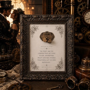 May include: A rectangular dark bronze ornate frame containing a white print with floral corners. The text reads: AUGUST 22, 2026, SO THEY ARE NO LONGER TWO, BUT ONE FLESH. THEREFORE WHAT GOD HAS JOINED TOGETHER, LET NO ONE SEPARATE. MATTHEW 19:6.