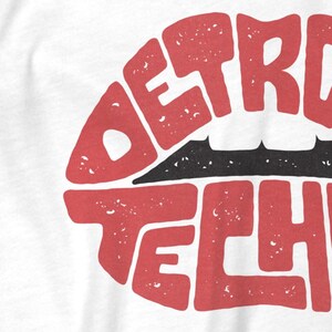 May include: Red lips with the words "DETROIT TECH" spelled out in a vintage style.