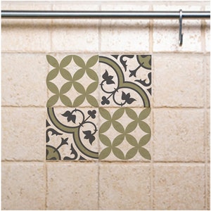 May include: Four square ceramic tiles with a geometric pattern in shades of green and black. The tiles are arranged in a grid pattern.