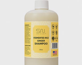 May include: A 16oz bottle of Seoul Naturals Fermented Rice Ginger Shampoo with a white pump dispenser. The yellow label features the product name, a list of ingredients, usage instructions, a barcode, and icons indicating cruelty-free status.