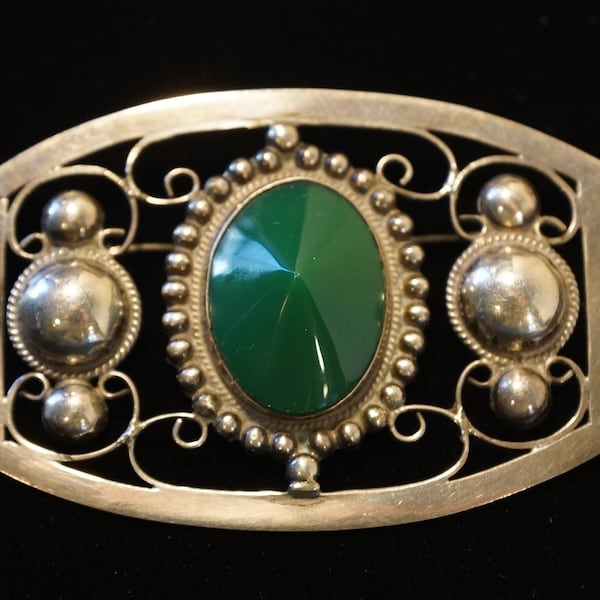 Mexican Silver Brooch with Green Gemstone at Center - Unsigned attributed to Fred Davis