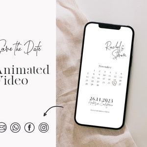 May include: A smartphone displays a wedding save-the-date animated video. The screen shows a calendar with the date November 26, 2023, highlighted with a heart. The names "Rachel & Steven" are at the top. The words "Save the Date" and "Animated Video" are also visible.