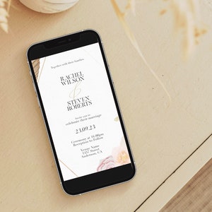 May include: A wedding invitation on a smartphone with a gold and white design. The invitation reads "Rachel Wilson & Steven Roberts" and includes the date "23.09.23".