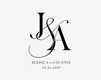 May include: Elegant black monogram design featuring the intertwined letters "J" and "A". Below, the names "Jessica and Austin" are written in a delicate script, along with the date "04.26.2027". The design is set against a soft, off-white background.
