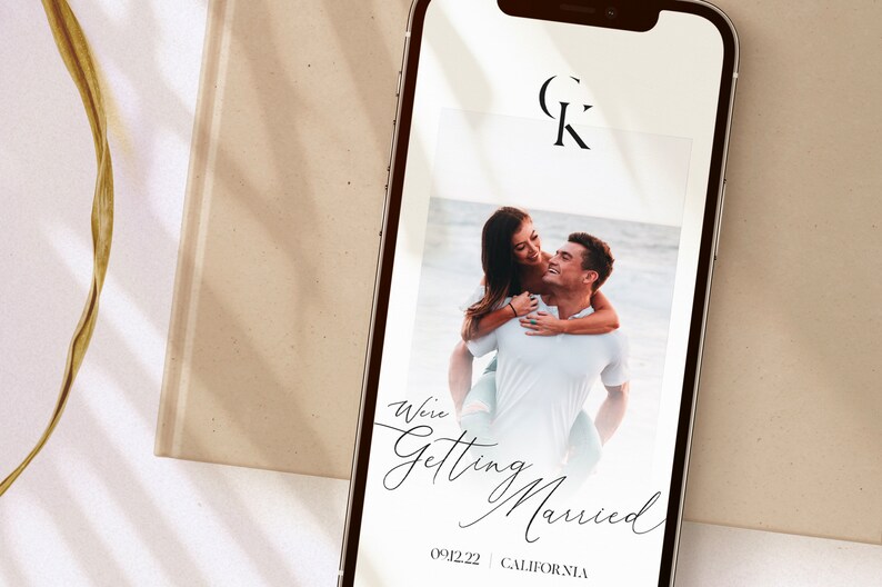 May include: A smartphone screen displaying a wedding announcement with a photo of a couple, the text "We're Getting Married", the date "09.12.22", and the location "CALIFORNIA".