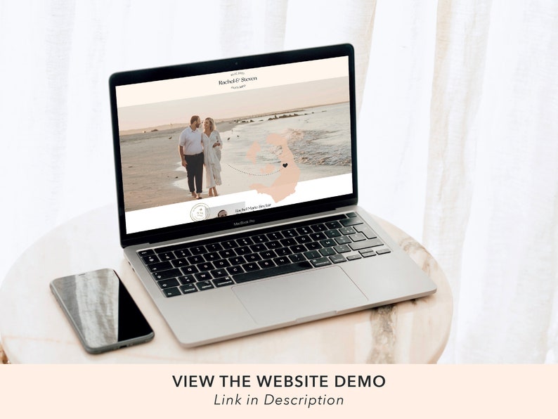 May include: A laptop computer displaying a wedding website with a couple walking on a beach. The website features a map with a heart icon marking their location. The text on the website reads "Rachel & Steven" and "Our Happy Day".