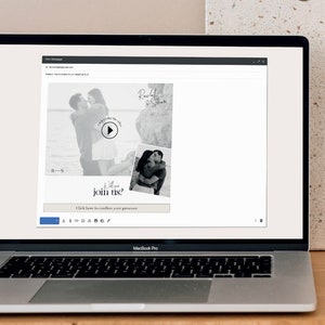 May include: A laptop screen displaying a wedding invitation with a black and white photo of a couple and a play button. The text on the invitation reads "Will you join us?" and "Click here to confirm your presence".