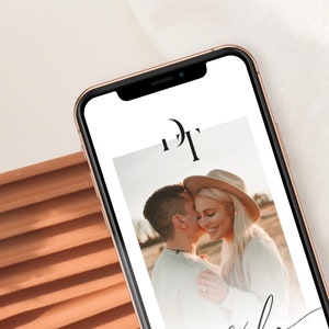 May include: A smartphone displaying a wedding announcement with a photo of a couple embracing. The announcement features the initials "D" and "T" in a modern font.