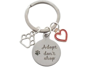 Chien, chat, animal de compagnie, sauvetage, retour à la maison, souvenir. Porte-clés « Adoptez, ne faites pas de shopping ». Gratuit pour aider à la collecte de fonds.