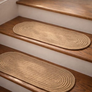 Partial staircase with oval jute stair treads installed, hand crocheted natural stair tread carpet