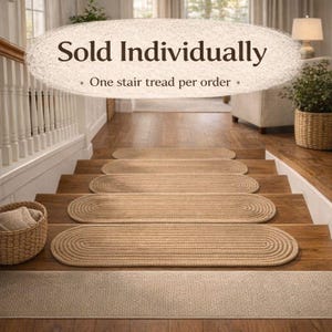 Set of oval jute stair treads installed on staircase, hand crocheted stair tread rugs sold individually