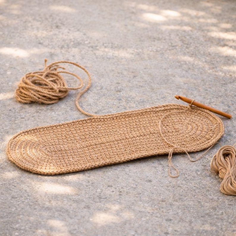 Hand crocheting jute stair tread using traditional crochet technique, handmade jute rug process