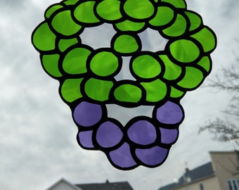 Stained Glass Grape Cluster Skull, inspired by Milton Glaser. Cool, glass art, skull, grapes, green, purple,