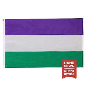 May include: A rectangular flag featuring three horizontal stripes in purple, white, and green. The left side has two metal grommets. A red rectangular badge in the bottom right corner displays the white text: HAND SEWN, a needle icon, and QUEER OWNED.