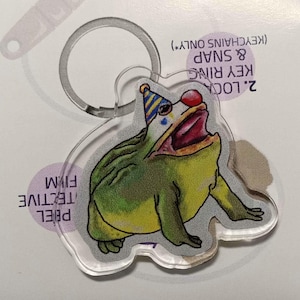 May include: A set of three ceramic mugs with a speckled, matte finish. The mugs are in shades of cream, light gray, and dark gray. Each mug has a simple, minimalist design, perfect for coffee or tea.