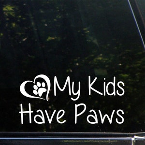 May include: White vinyl decal with a heart shape containing a paw print and the text "My Kids Have Paws".