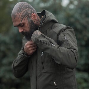 Stylish olive green winter jacket for men – festival-ready outerwear with modern design.