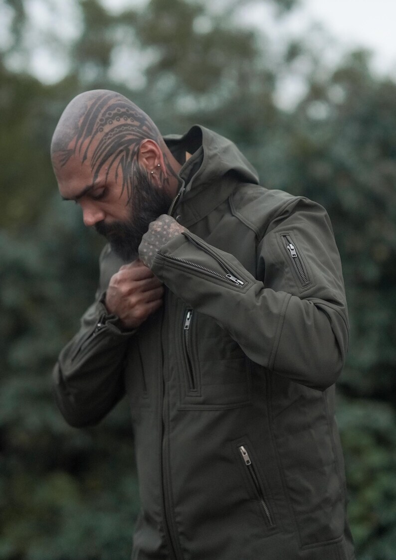 Stylish olive green winter jacket for men – festival-ready outerwear with modern design.