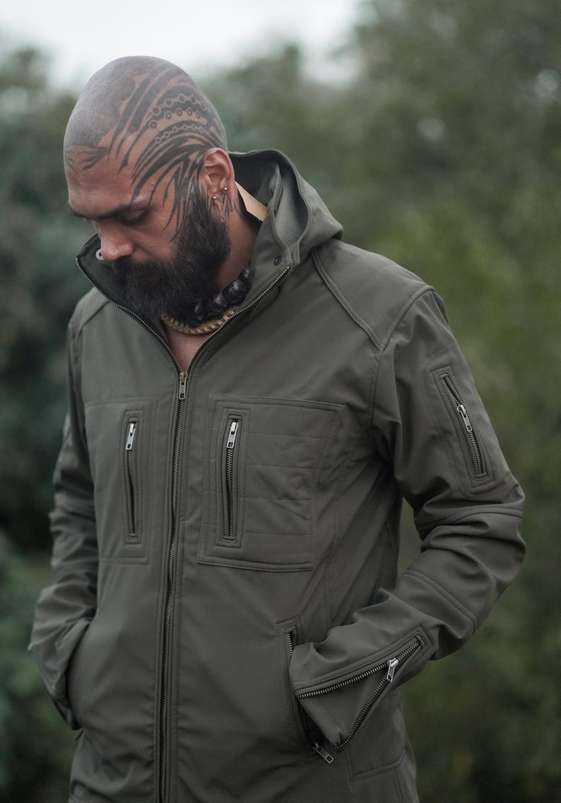 Olive green men’s winter jacket with removable hood – windproof soft shell design.