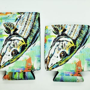 May include: Two colorful neoprene can coolers with a graphic of a fish with a white background and a colorful abstract design.
