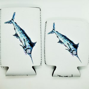 May include: Two white neoprene can coolers with a blue and white marlin fish design. The fish is facing right on the left cooler and left on the right cooler.
