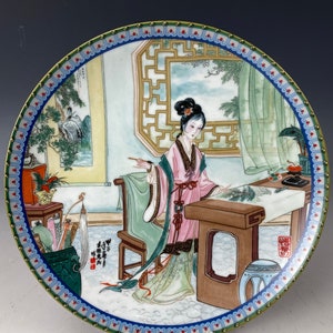 A Chinese Famille Rose Porcelain Plate of Dream of the Red Chamber XiChun