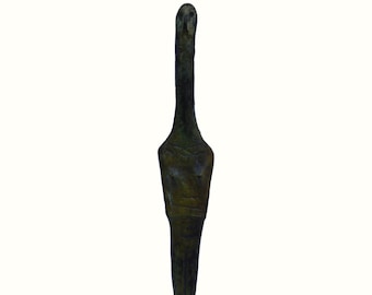 May include: A tall, slender bronze sculpture featuring an elongated, abstract human-like figure with a dark, weathered patina. The figure stands upright on a square, polished dark brown marble base, showcasing a textured surface and minimalist form.