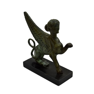 Sphinx Bronze statue Ancient Greek marble based aged sculpture