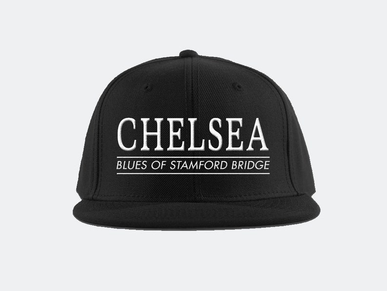 May include: Black baseball cap with white embroidered text that reads "Chelsea Blues of Stamford Bridge".