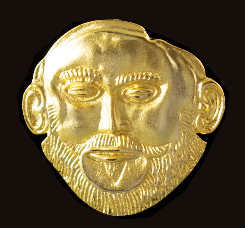 Handcrafted gold plated 925 sterling silver versatile jewel depicting the Mycenaean mask of Agamemnon.Museum copy.It can be worn either as a pendant or as a brooch.Its length is 4cm,its width is 4cm and weighs approx. 13g.