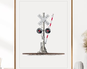 May include: A framed wall art print featuring a detailed illustration of a railroad crossing signal. The signal includes a white crossbuck sign with the black text RAIL CROSSING ROAD, two red circular lights, and a red and white striped gate arm.