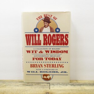 May include: A book titled "The Best of Will Rogers: Wit & Wisdom for Today" by Bryan Sterling with a foreword by Will Rogers, Jr. The cover features a photo of Will Rogers in a cowboy hat.