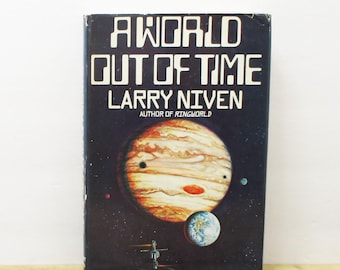 May include: A World Out of Time by Larry Niven, a science fiction novel with a cover featuring a colorful planet with a face and a smaller blue planet in the background.