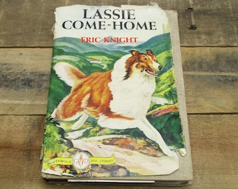 May include: A vintage paperback book titled "Lassie Come-Home" by Eric Knight. The cover features a colorful illustration of a Collie dog running through a green field.
