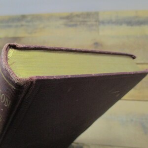 May include: A burgundy hardcover book with gold-colored lettering on the spine. The spine reads "Carson's Poems".