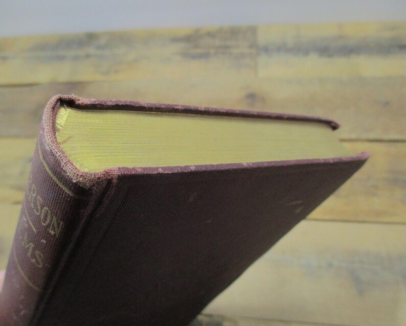 May include: A burgundy hardcover book with gold-colored lettering on the spine. The spine reads "Carson's Poems".