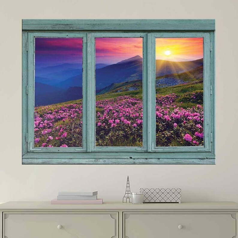 Sunset over blue mountains and rocky soil with flowers in bloom-Wall Mural