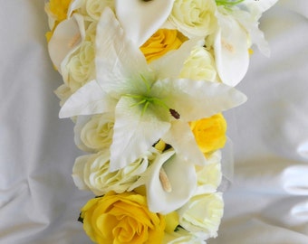 Brides cascade wedding bouquet yellow and ivory lilies and roses lilies, roses and callas