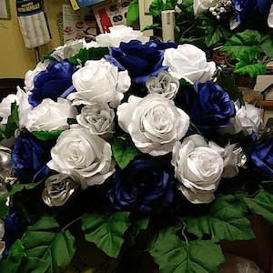 Wedding table arrangement  silver blue and white