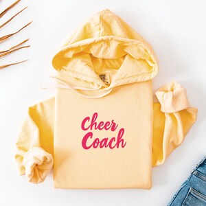 Cheer Coach Comfort Colors Hoodie Cute Cheerleading Gift Unisex Lightweight Hooded Sweatshirt Sports Fan Team Gift College Apparel Coach