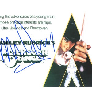 May include: A promotional poster for Stanley Kubrick's film, "A Clockwork Orange." The poster features the film's title and a stylized image of a character with a bowler hat, holding a knife and an eyeball. The poster includes text about the film's themes.