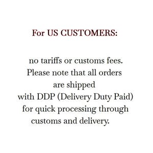 May include: A white rectangular graphic with black serif text that reads: For US CUSTOMERS: no tariffs or customs fees. Please note that all orders are shipped with DDP (Delivery Duty Paid) for quick processing through customs and delivery.