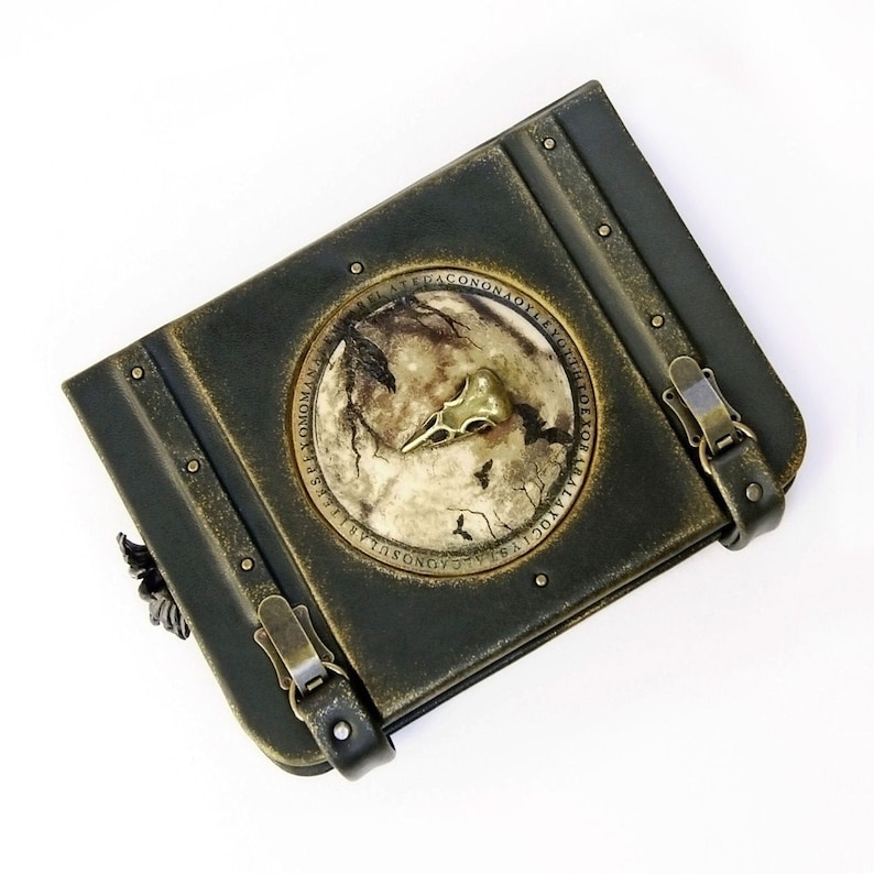 Leather journal lockable with raven skull on the cover