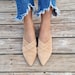 MULES SLIPPERS IN BEIGE SUEDE WITH GOLD COIN