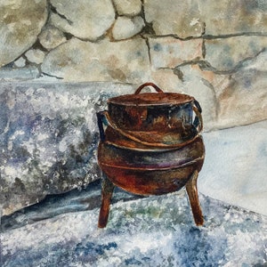 May include: A rustic, brown cast iron pot with three legs sits on a gray and white textured surface. The pot has a lid and a rope handle.